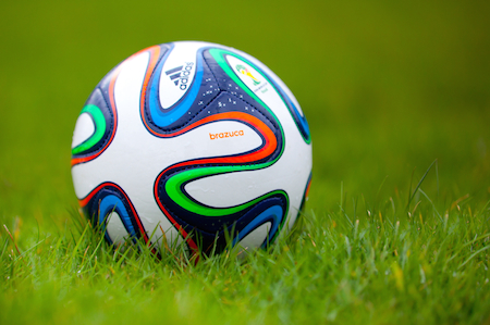 photo of soccer ball on grass