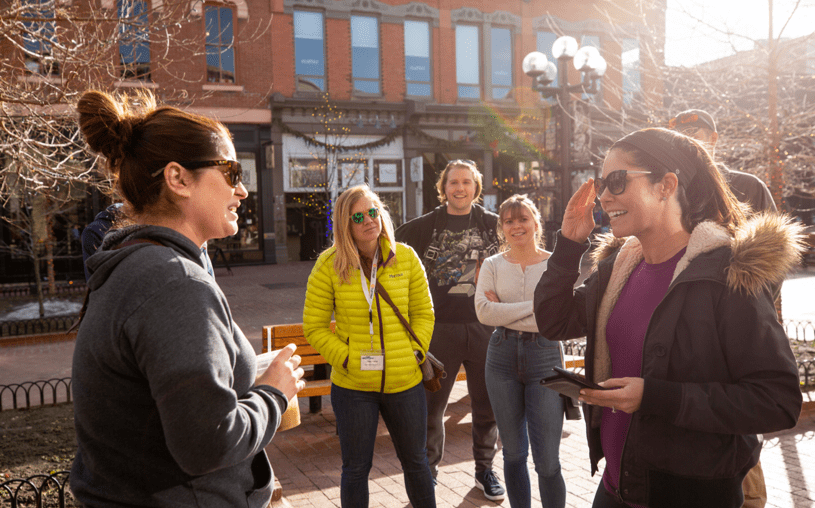 photo of women talking together outside