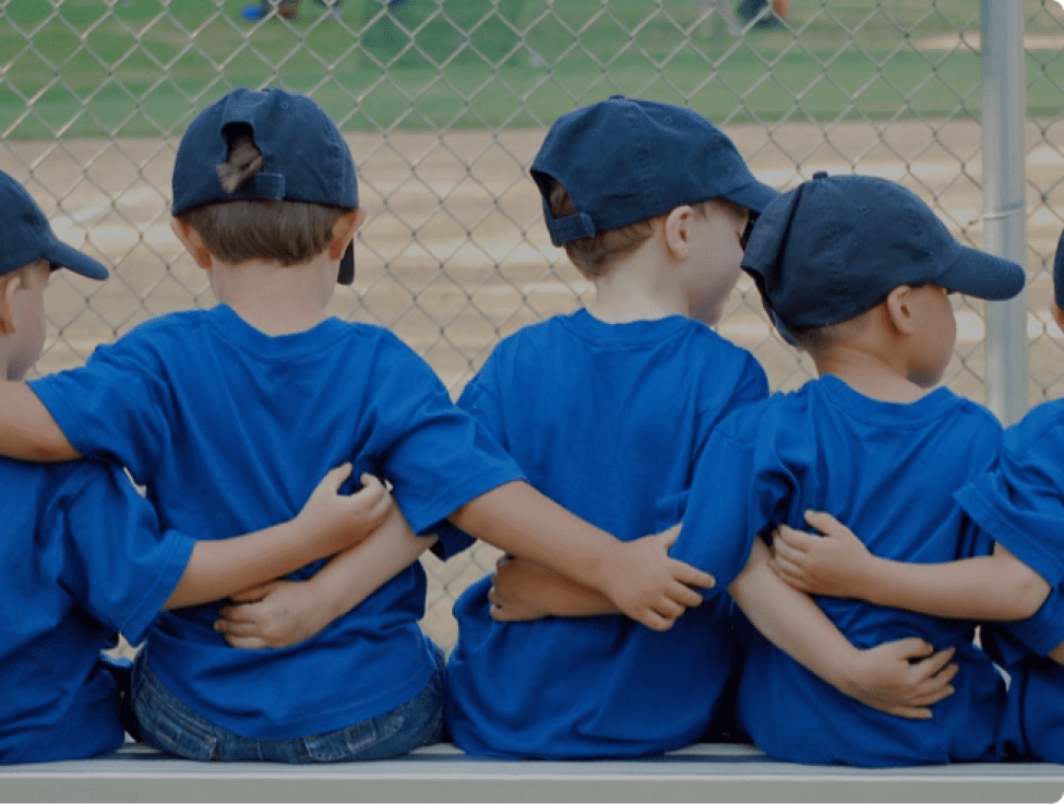 A group of baseball players hugging each other