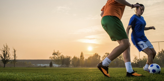 Photo of someone kicking a soccer ball