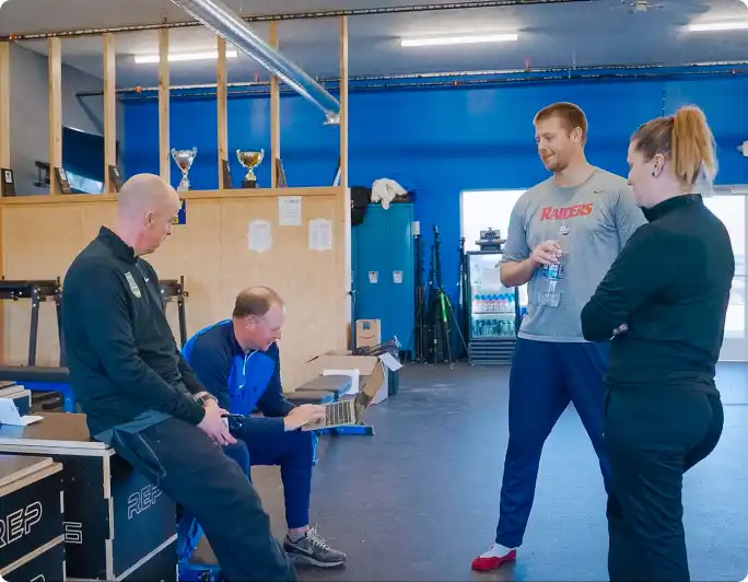Photo of a sport org admins in their facility