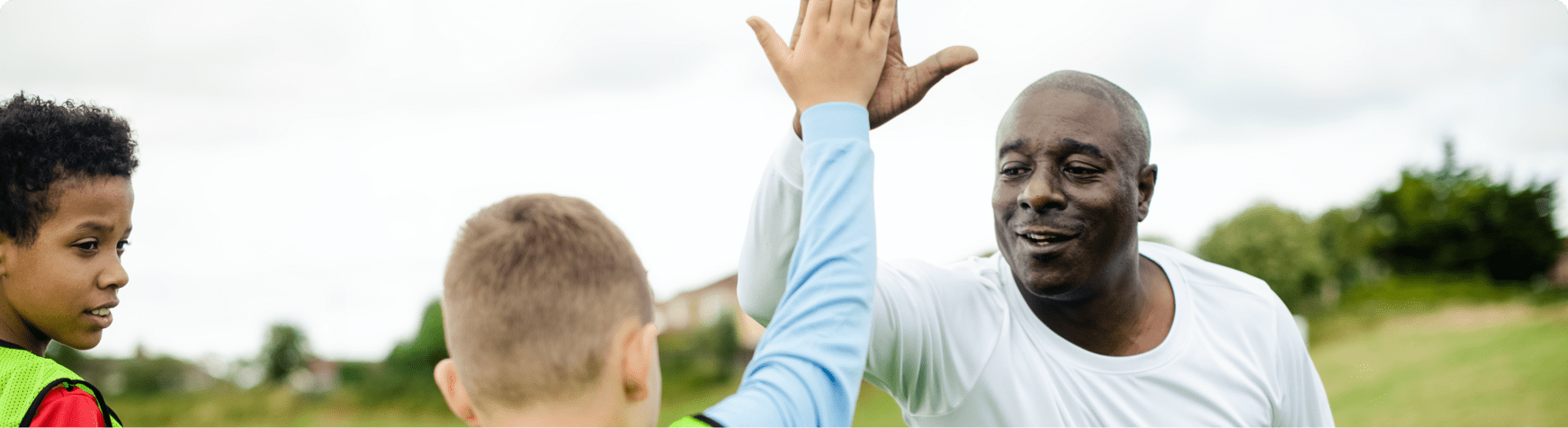 A coach high fiving his team