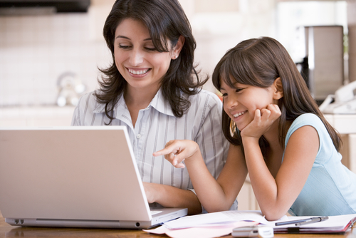 photo of a mother and daughter using a computer