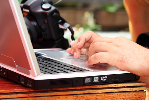 photo of a child's hands on a laptop